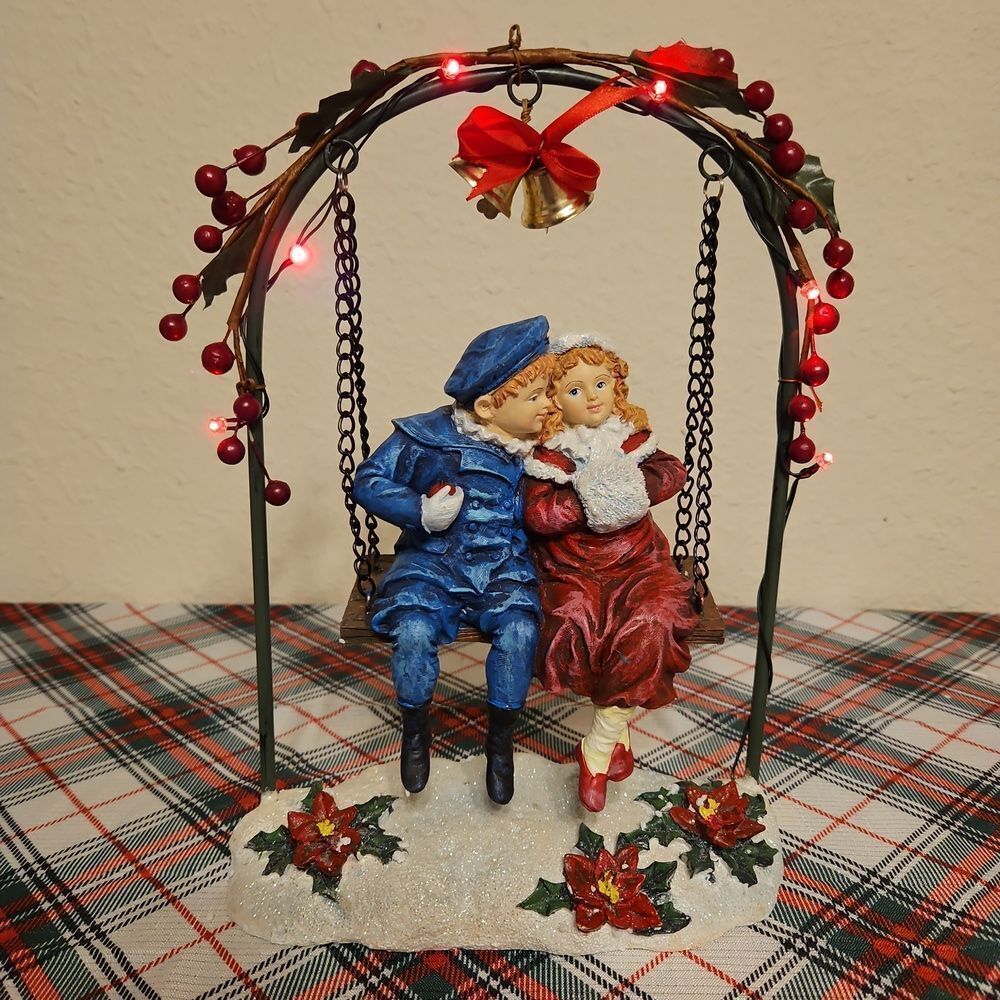 Romantic "Holiday Sweathearts" Swinging Under Lighted Mistletoe Arbor Decor